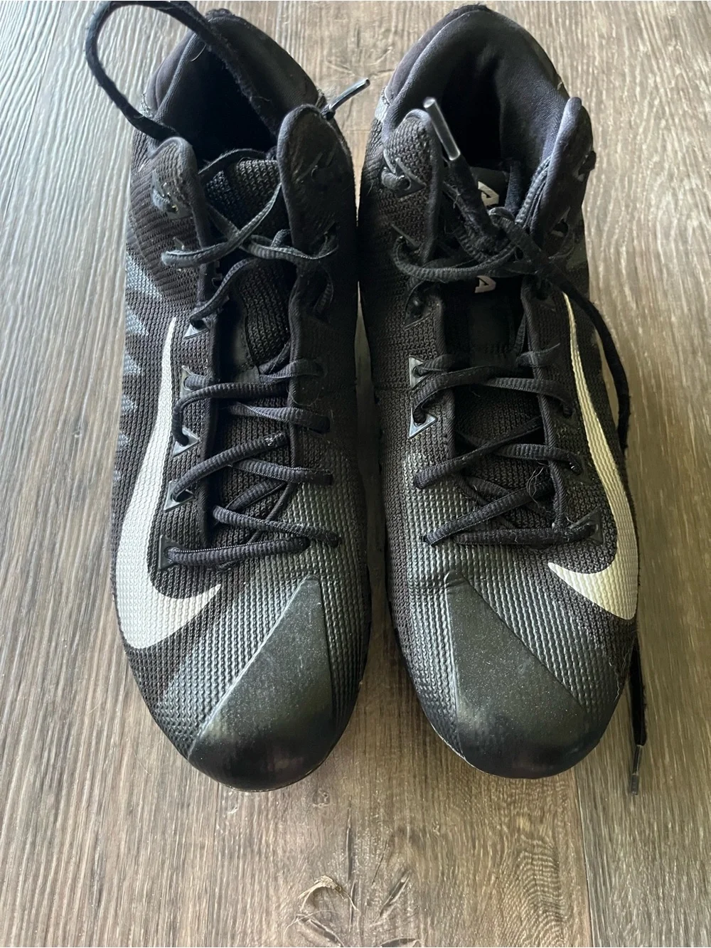 Nike Menace Men’s Black Cleats with White Swoosh